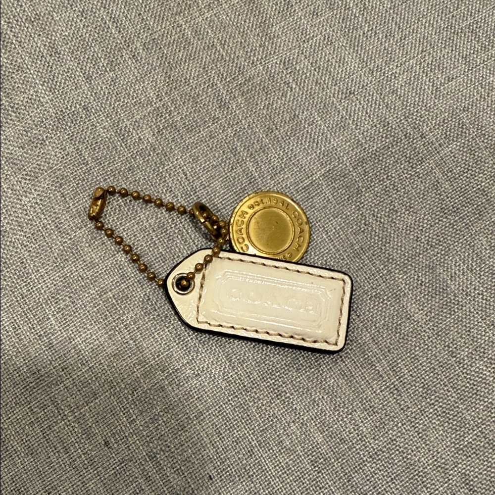 Coach Gold and White Hang Tag Keychain